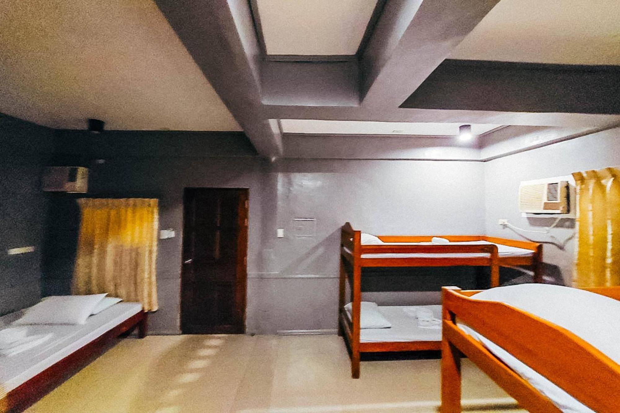 Mbg Travellers Inn Powered By Cocotel Puerto Princesa Habitación foto