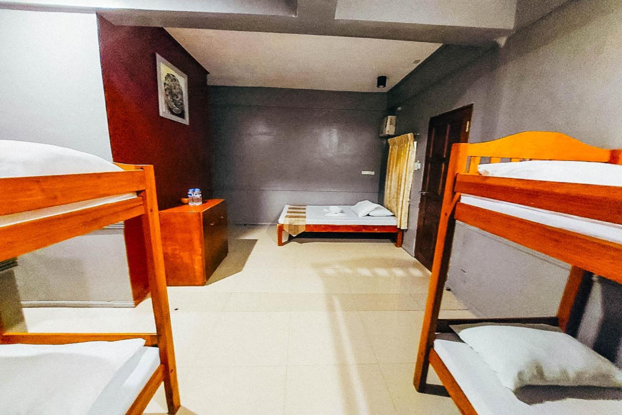 Mbg Travellers Inn Powered By Cocotel Puerto Princesa Habitación foto