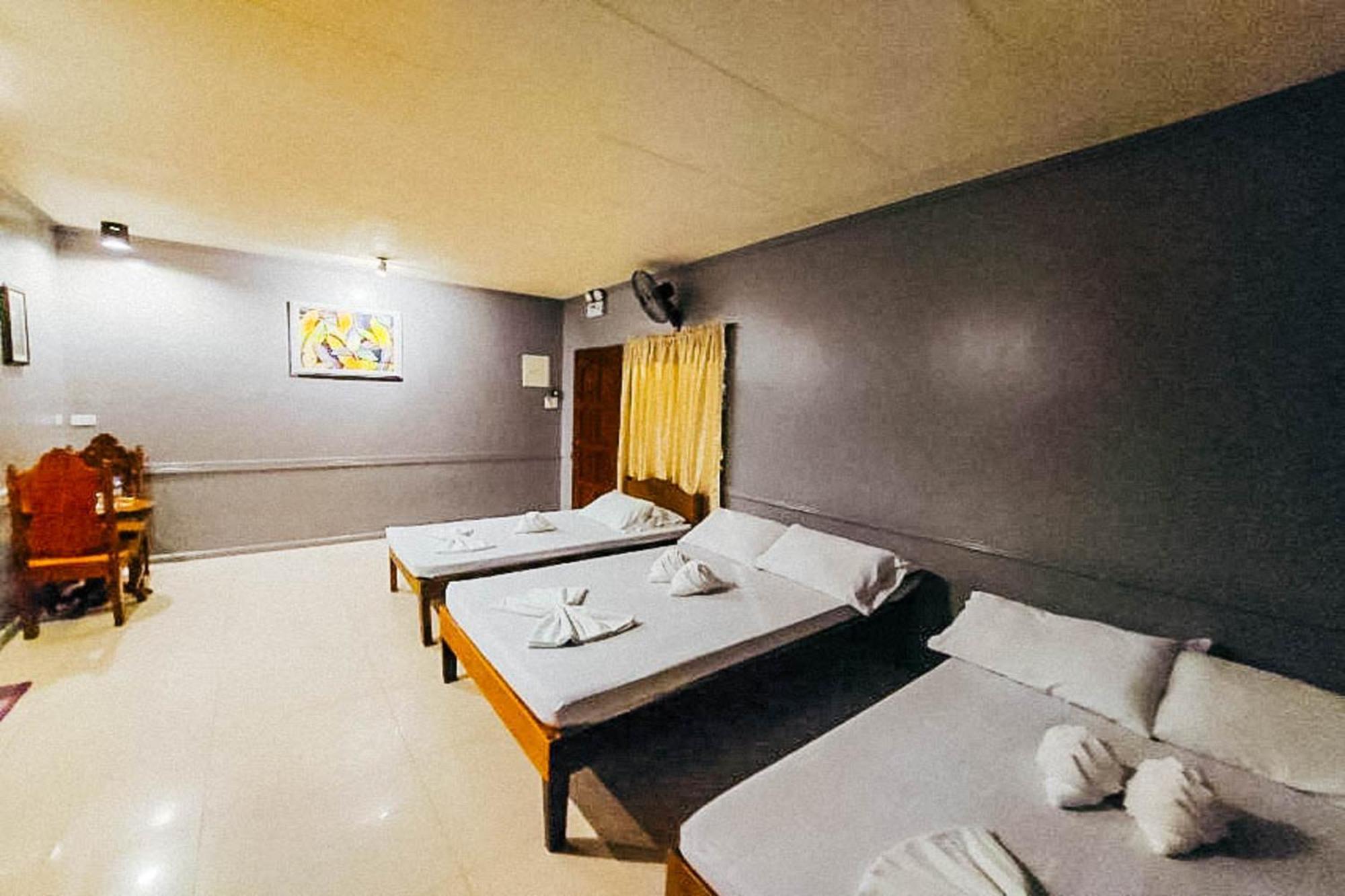 Mbg Travellers Inn Powered By Cocotel Puerto Princesa Habitación foto