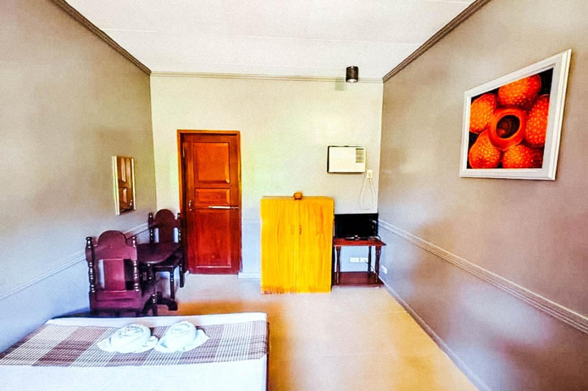 Mbg Travellers Inn Powered By Cocotel Puerto Princesa Habitación foto