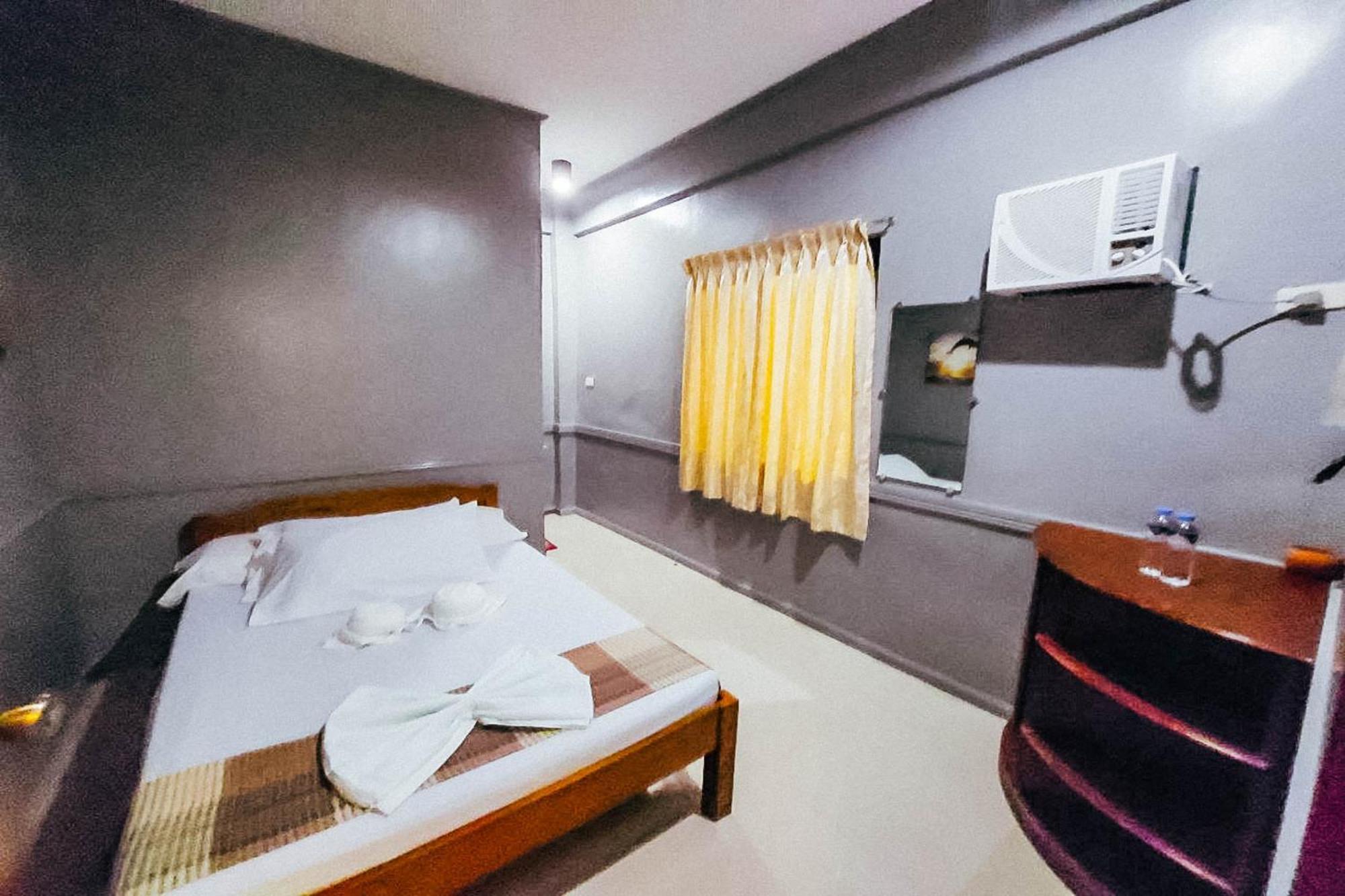 Mbg Travellers Inn Powered By Cocotel Puerto Princesa Habitación foto