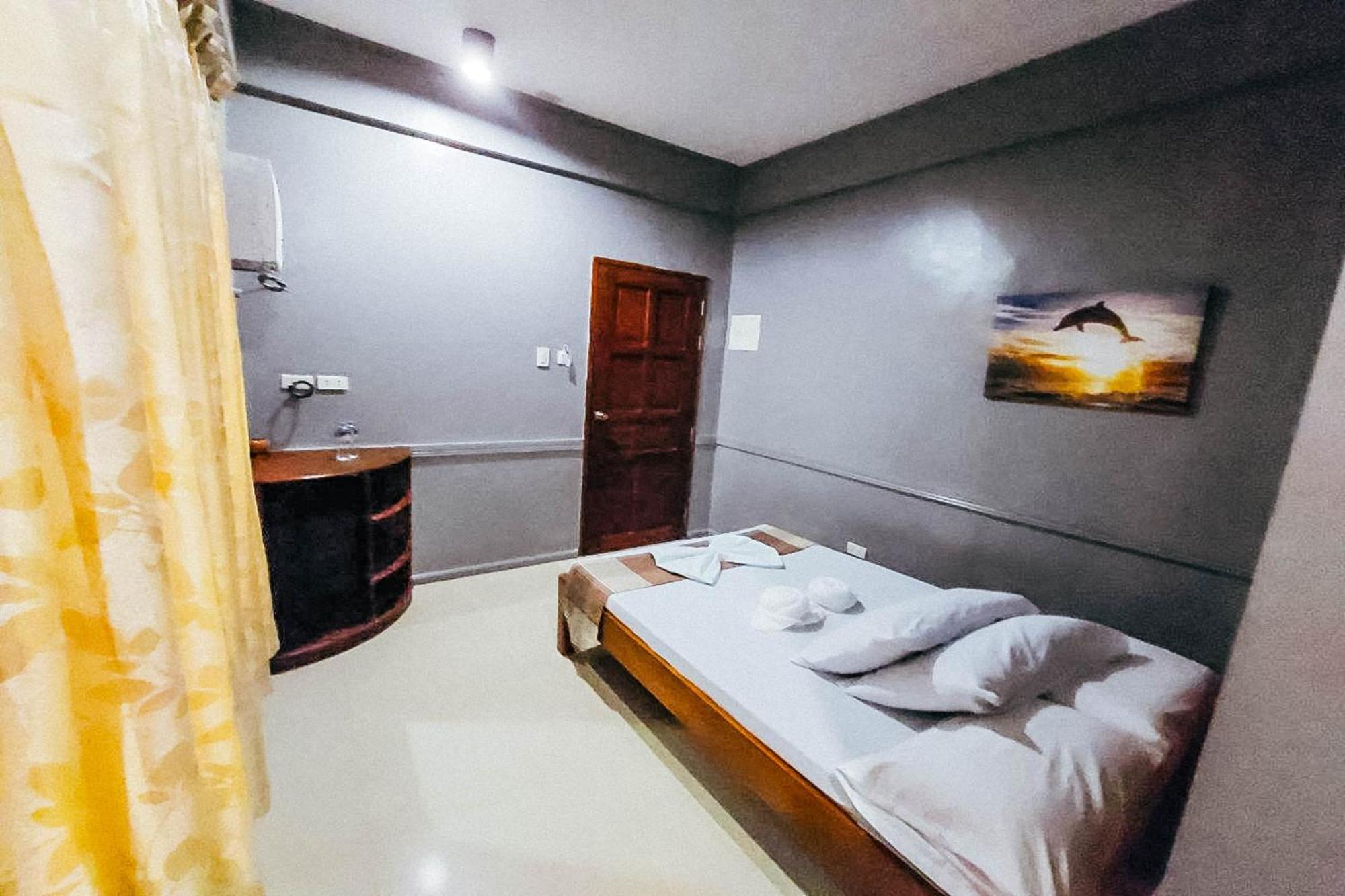 Mbg Travellers Inn Powered By Cocotel Puerto Princesa Habitación foto